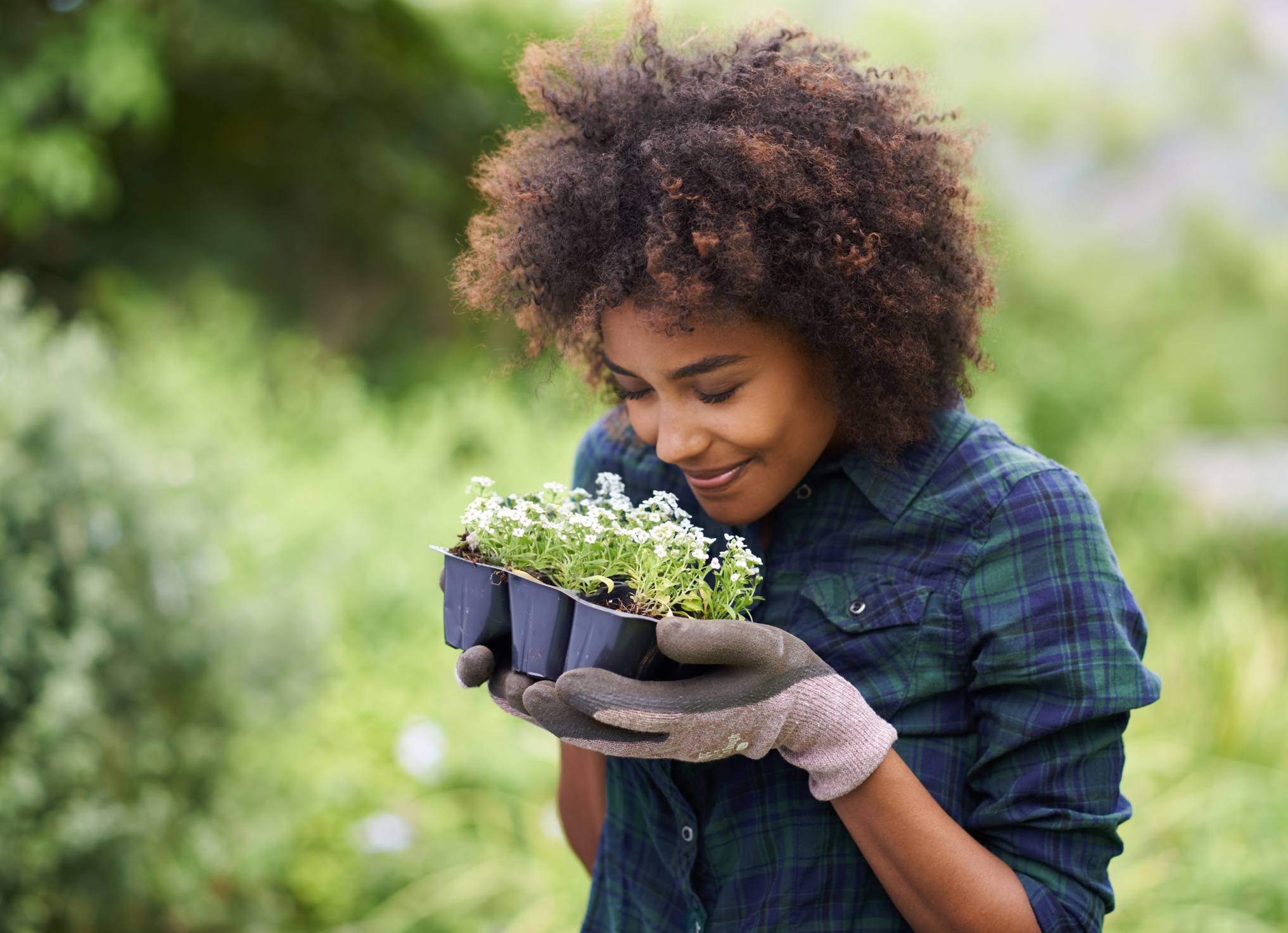 Woman smelling Spring flowers